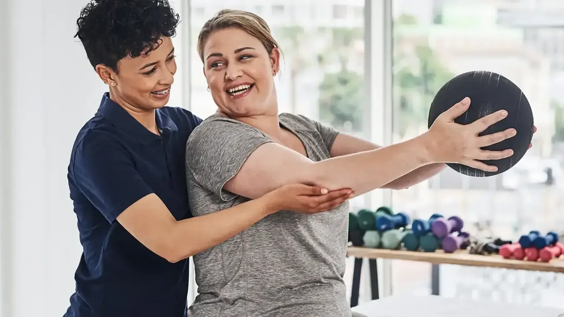 A physical therapy treatment space, illustrating the patient reviews page for HJ Manhattan Physical Therapy in New York, NY